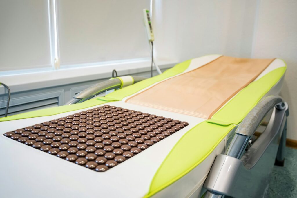 Empty massage couch for medical procedures close